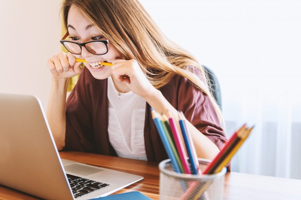 student in front of laptop